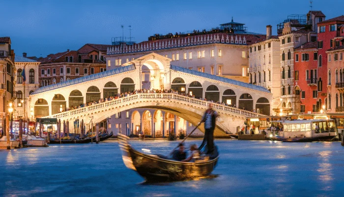 Romantic gondola ride near Rialto Bridge in Venice, Italy